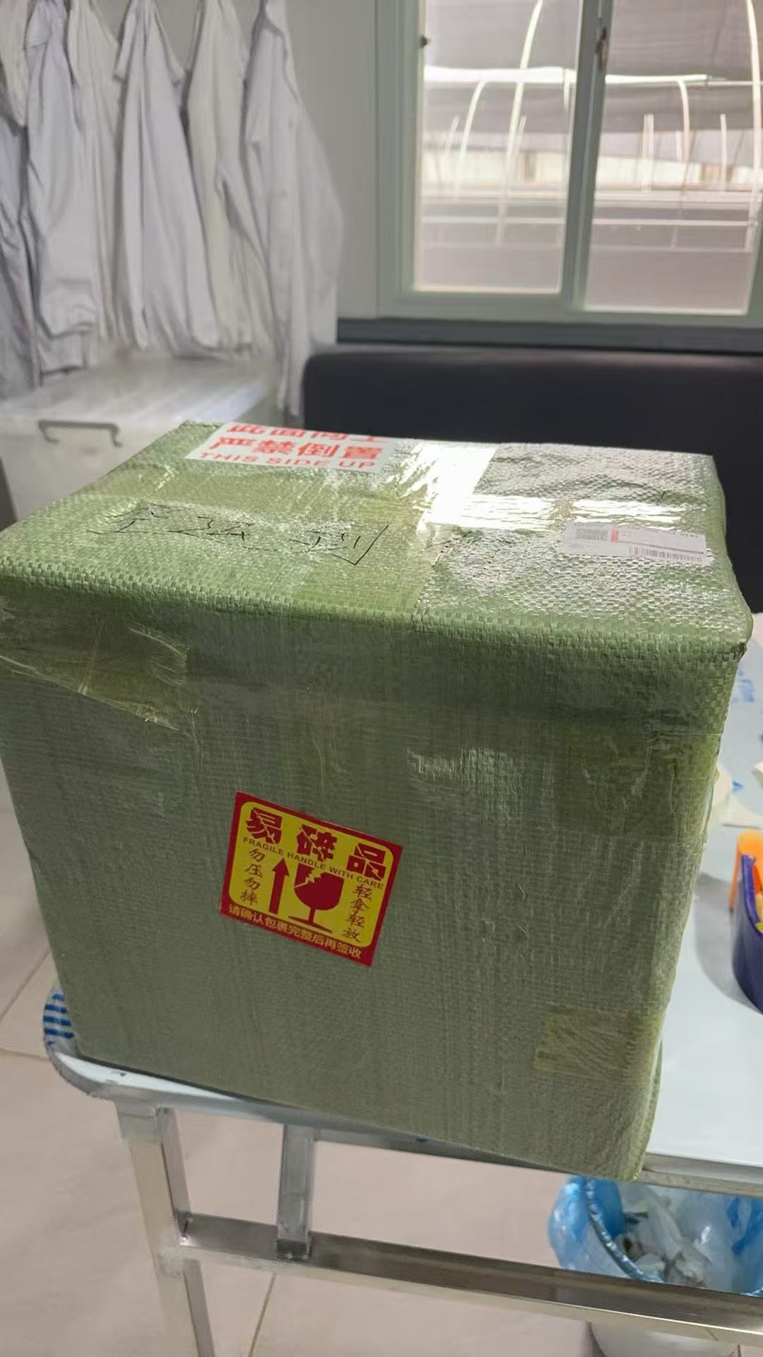 Shipping box with green protective wrapping